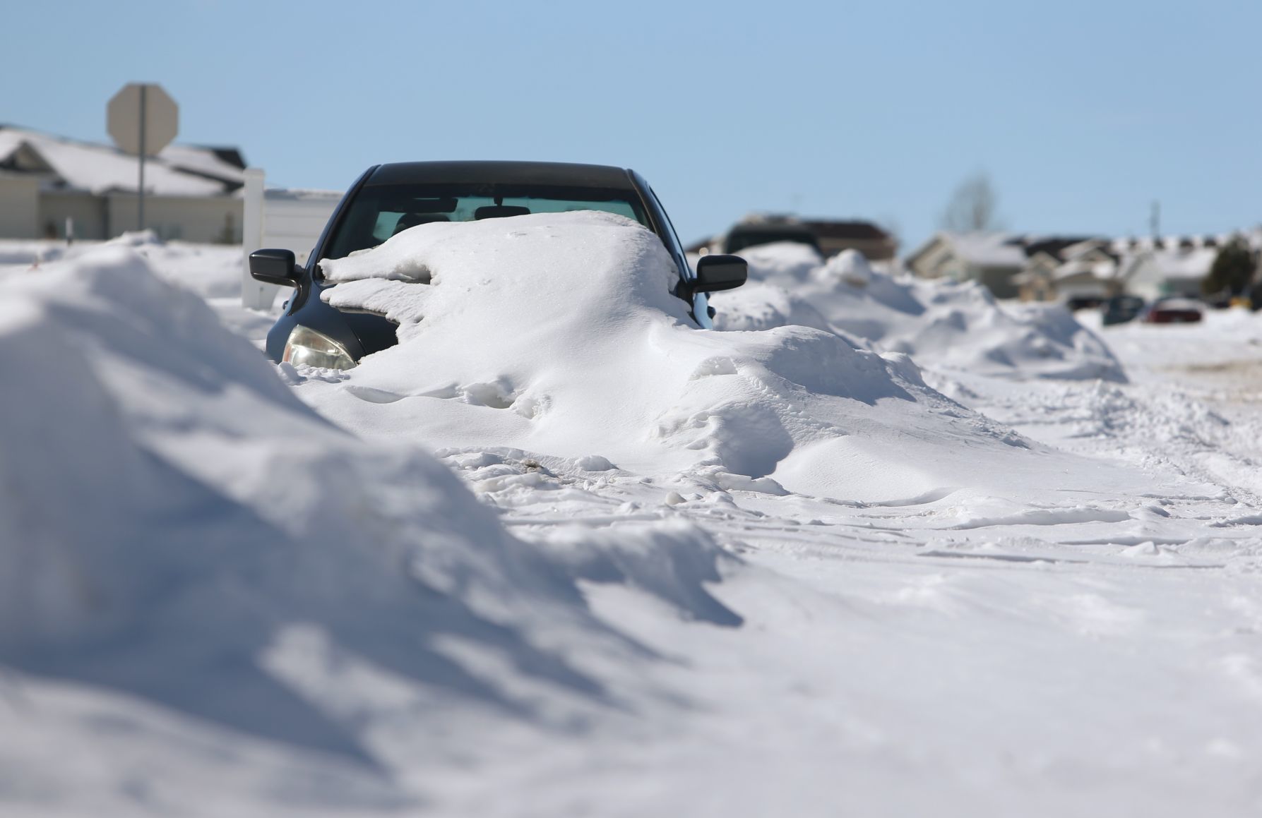A car is buried in the snow